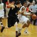 Huron senior Andre Bond moves the ball past Pinckney sophomore Jordan Welser during a district match up at Pioneer on Wednesday. Melanie Maxwell I AnnArbor.com